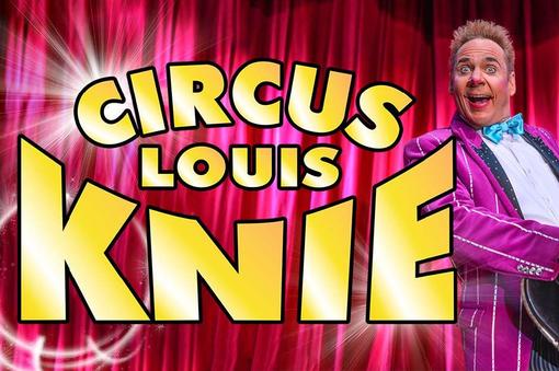 The lettering Circus Louis Knie in yellow color on red-pink background, right in the picture a laughing man in pink jacket, white shirt, with light blue bow tie