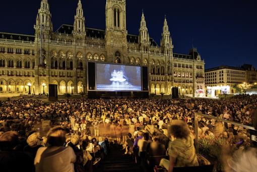 Photo Film Festival in front of the Vienna City Hall: big cinema screen, audience in front of it
