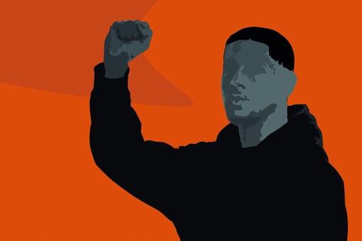Poster showing man in black hoody with raised fist, bright red background