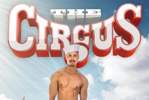 Photo of a poster with the words "The Circus" in white and orange-red color, under it a young man with naked torso and sailor cap