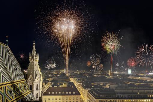 View from St. Stephen's Cathedral over the fireworks on New Year's Eve over the city center of Vienna 