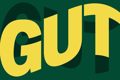 The image shows the word GUT in capital letters and yellow color on a dark green background.