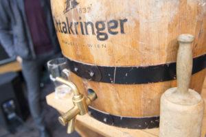 Photo of wooden beer keg with tap and wooden mallet next to it
