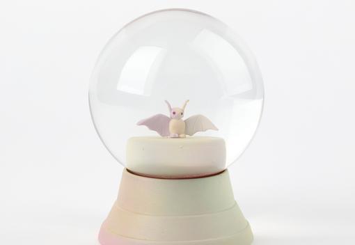 Custom snow globe, with a small white bat inside