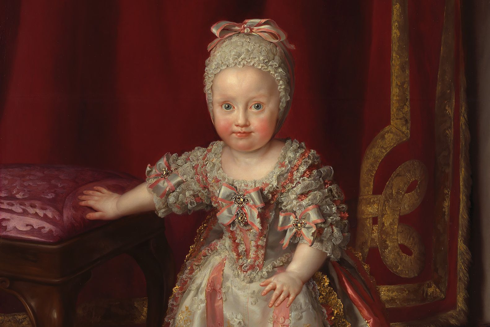 The painting shows Marie-Therese of Bourbon-Sicily, Princess of Naples as a small child in a Baroque ceremonial gown and lace bonnet